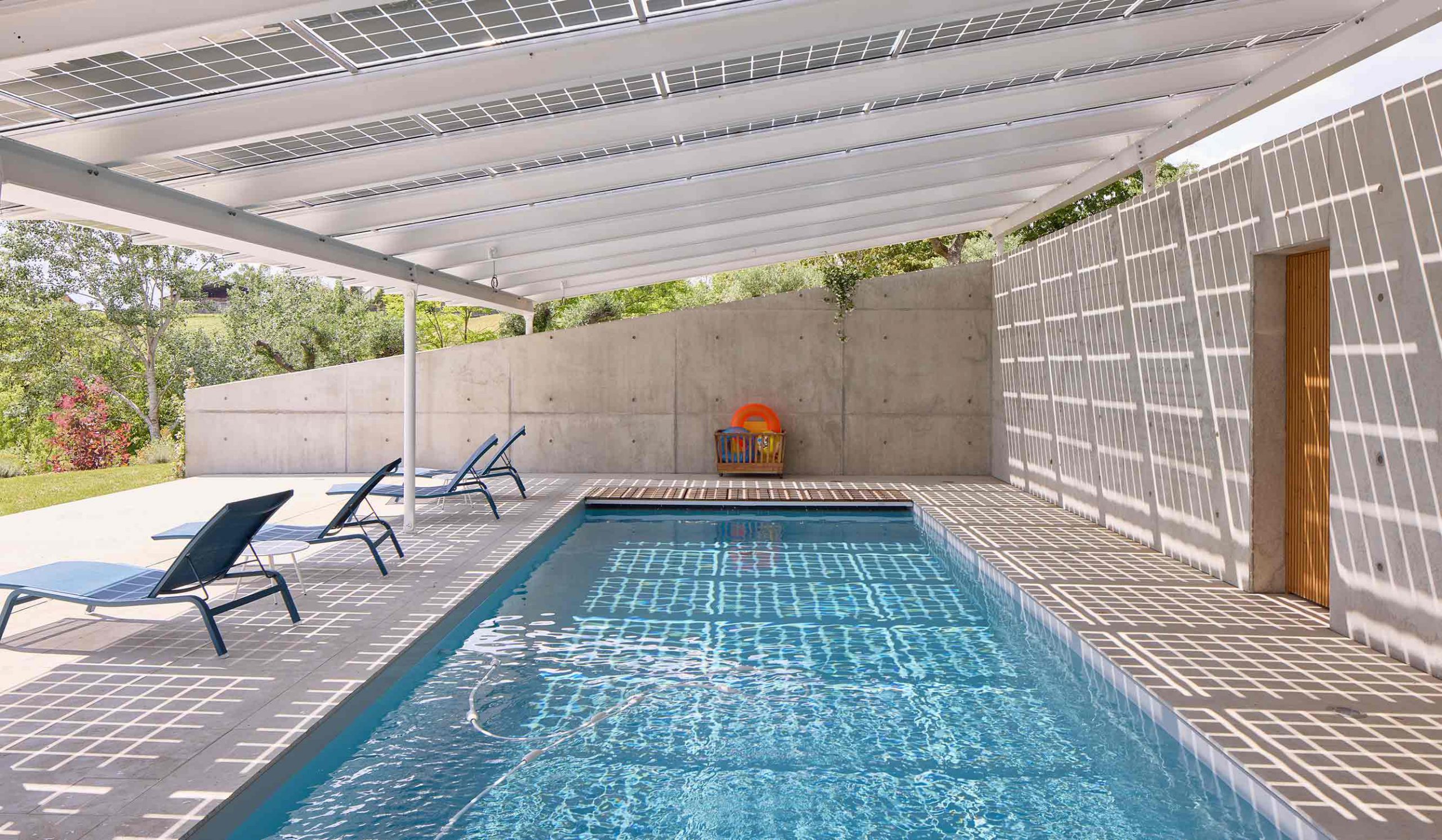 A Sustainable Beacon: With 70 Bifacial PV panels, the new roof of the pool house celebrates the power of sustainability, and marks the landscape as a possible future for the region.